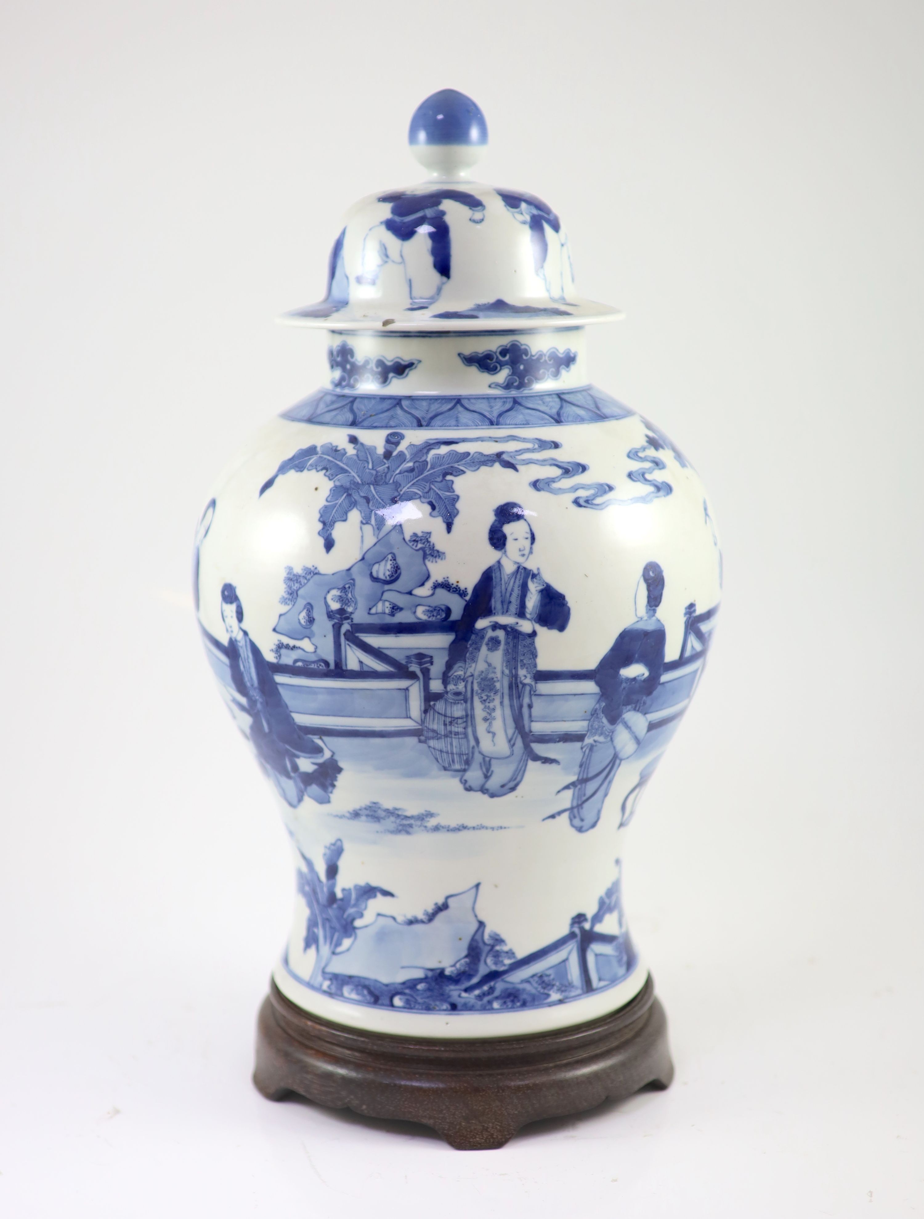 A large Chinese blue and white ‘ladies’ vase, Kangxi mark, 19th century, 44cm high, wood stand